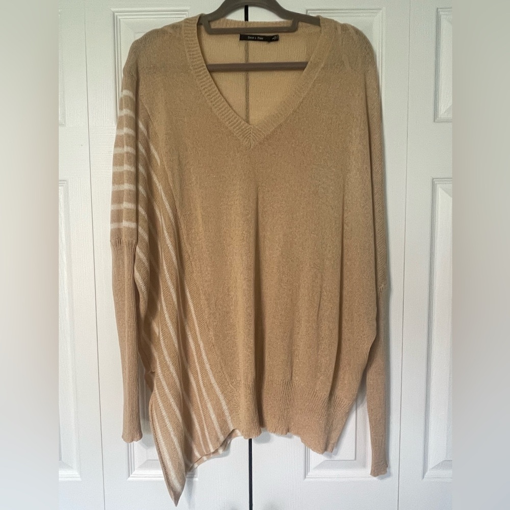 Sweater with asymmetrical hem